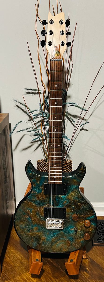 Guitar-themed woodworking piece